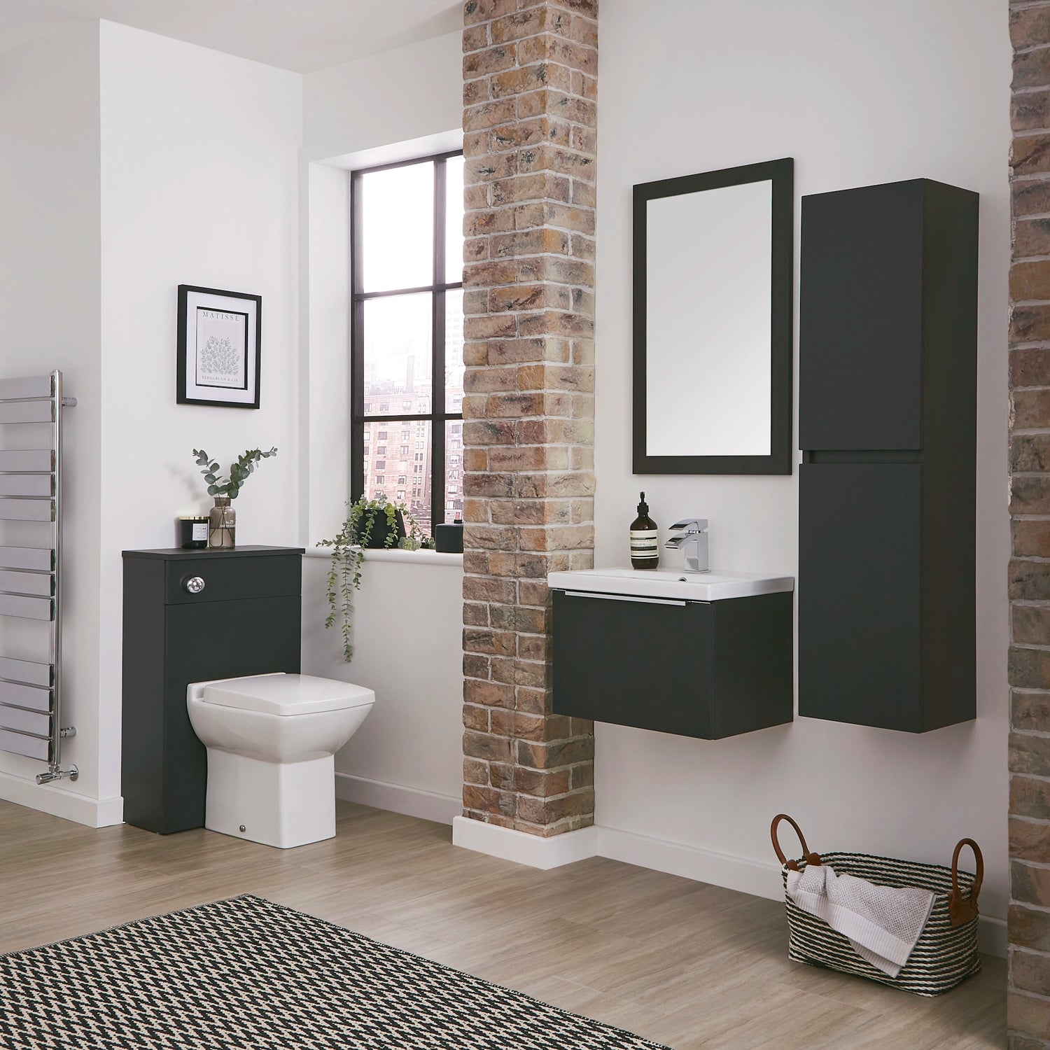 Lifestyle Photo of the Core range featuring a WC Unit, Tall Boy, Vanity Unit and Mirror