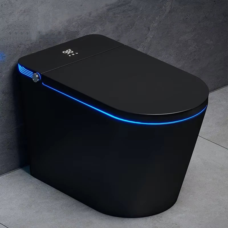 A modern, high-tech black smart toilet and bidet with blue LED lighting around the lid, featuring a sleek design and a digital display on the lid.